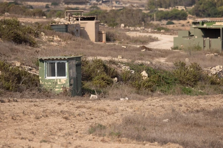 Desolate Landscape with Abandoned Structures