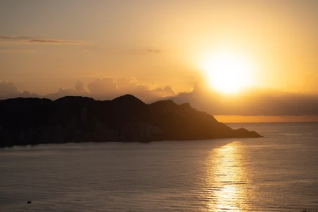 Sunset Over Coastal Cityscape
