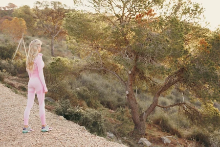 Woman in Pink Gym Wear in Nature