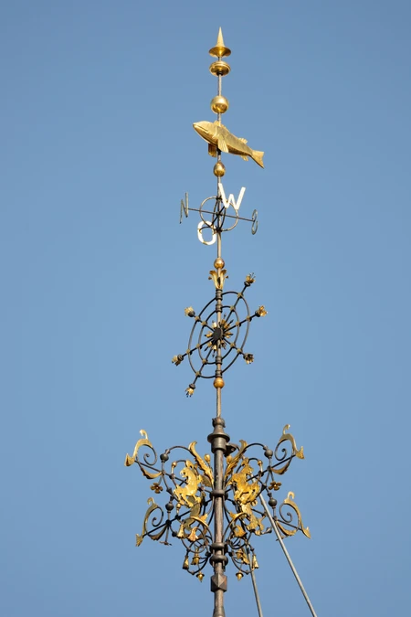 Ornate Weather Vane Against a Blue Sky