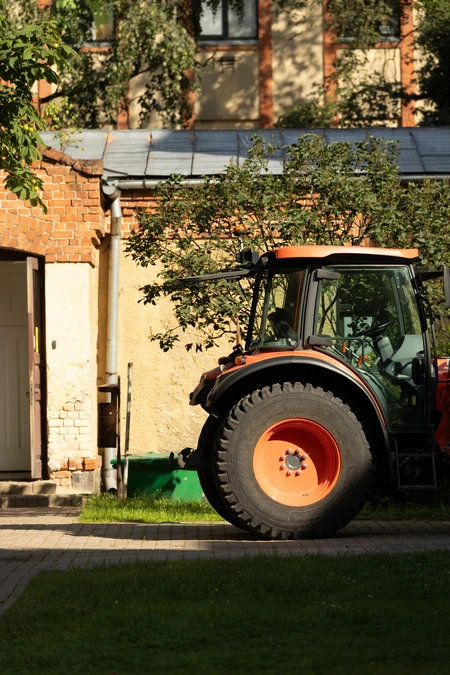 Tractor by Brick Building