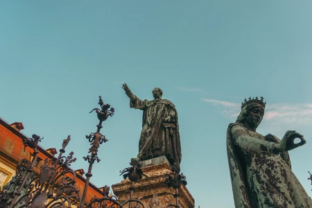 Historic Statues Against Blue Sky
