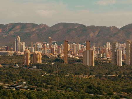 Cityscape with Mountain Backdrop