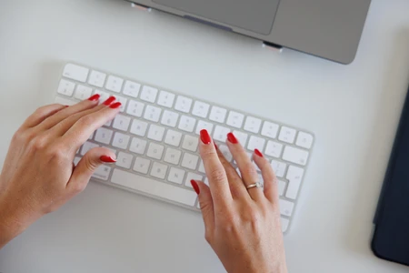 Hands Typing on Keyboard