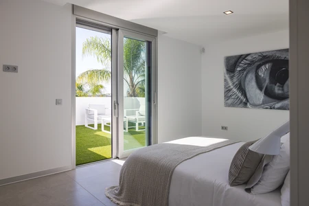 Modern Bedroom with Balcony View
