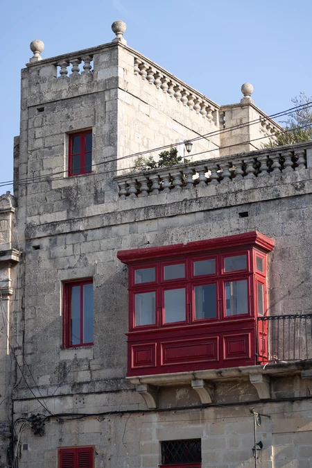 Historic Stone Building with Red Accents