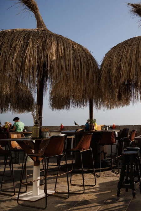 Seaside Lounge with Straw Umbrellas