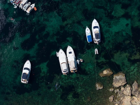 Aerial View of Boats on Clear Waters