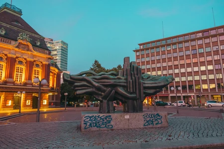 Urban Evening Scene with Sculpture
