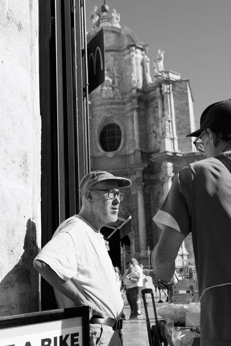 Street Encounter by Historical Building