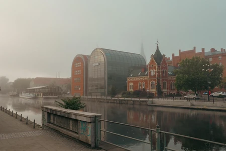 Misty Riverbank Architecture