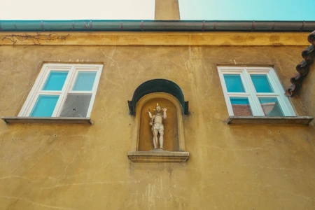 Old Building Facade with Statue