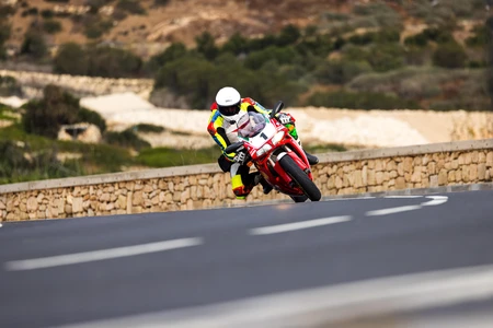 Motorcyclist on a Curvy Road