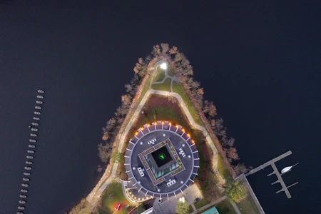 Aerial View of a Modern Building on Water