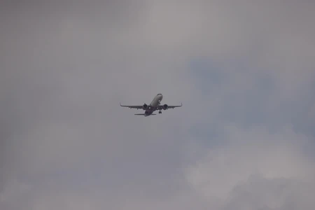 Airplane in the Cloudy Sky