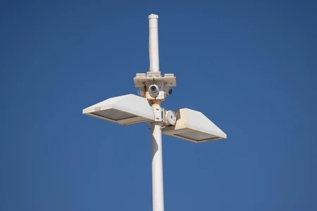 Minimalist Streetlight Against Blue Sky