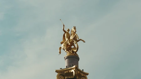 Golden Statue Against Sky