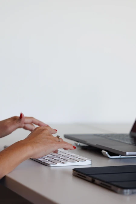 Hands Typing on a Keyboard