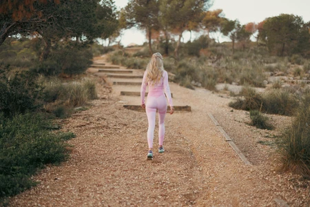 Woman Walking on Trail