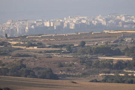 Rural Landscape with City Skyline