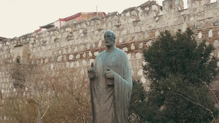 Historic Statue by Ancient Wall
