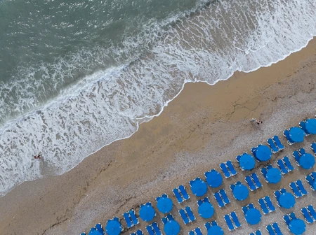 Coastal Relaxation with Blue Umbrellas
