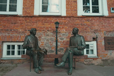 Historic Bronze Sculptures in Brick Courtyard