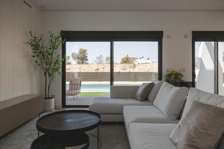 Modern Living Room with Pool View