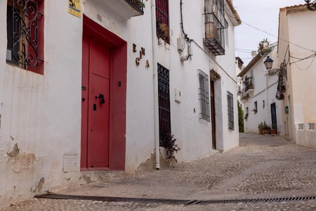 Quaint Alleyway with Red Door