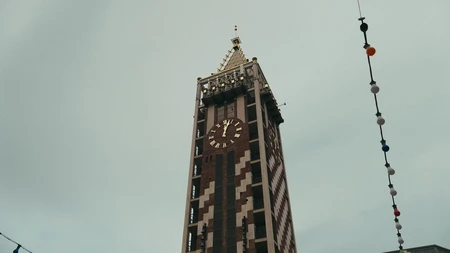Clock Tower Against Cloudy Sky