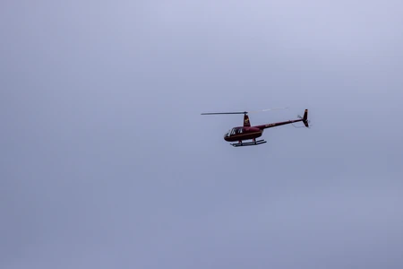 Helicopter Against a Cloudy Sky