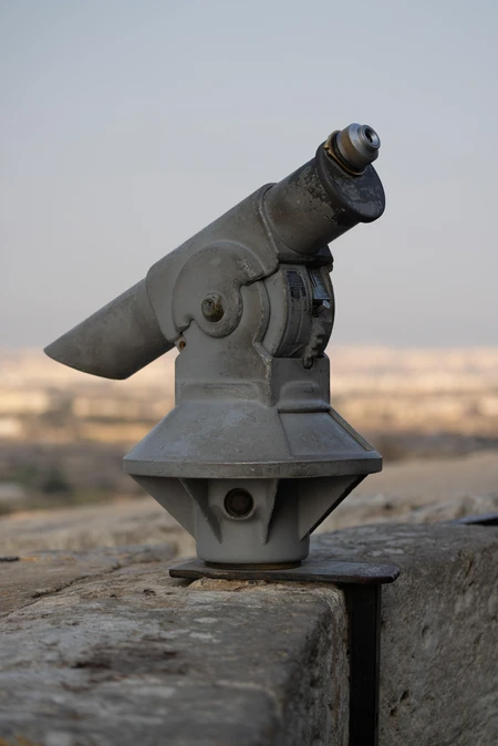 Vintage Telescope on Stone Ledge