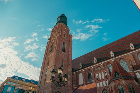 Historic Church Tower Under Blue Sky