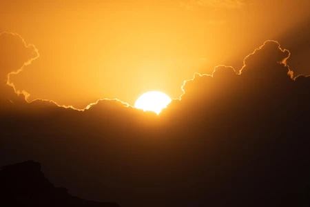 Golden Sunset Behind Clouds