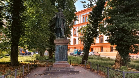 Historic Statue Amidst Urban Nature