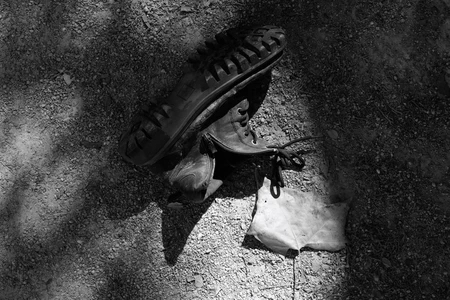 Abandoned Boots in Shadow