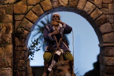 Figurine Under Stone Arch