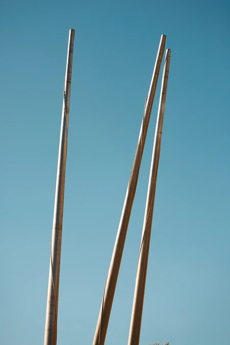 Tall Poles Against Blue Sky