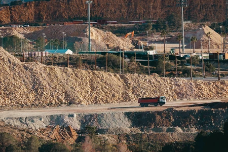 Quarry with Trucks and Machinery