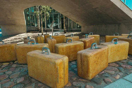 Suitcases Sculpture Under Bridge