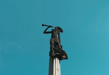 Statue Against Blue Sky