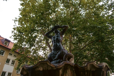 Statue in a Tree-lined Square