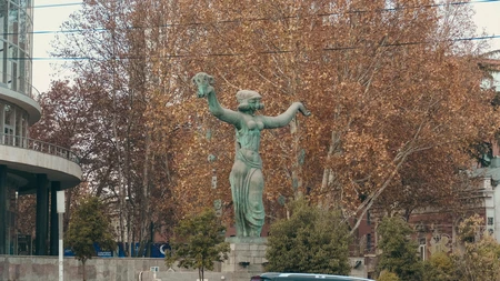 Statue in Autumn Urban Setting