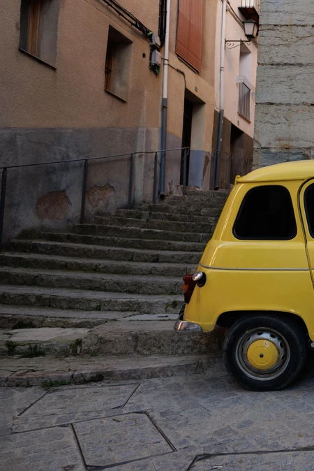Vintage Car on Cobblestone Street