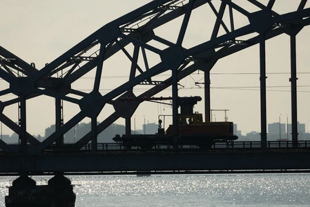 Silhouette of a Train on a Steel Bridge