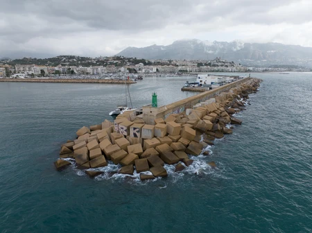 Seaside Breakwater with Cloudy Skies