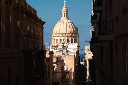 Grand Architectural Dome in Sunlit Alley