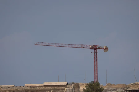 Construction Crane over Urban Landscape