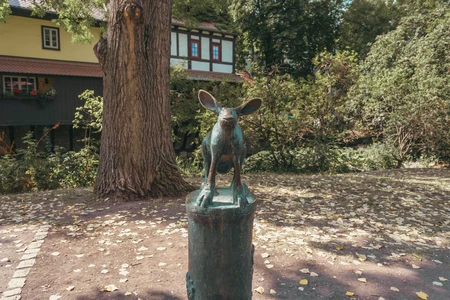 Statue in a Scenic Park