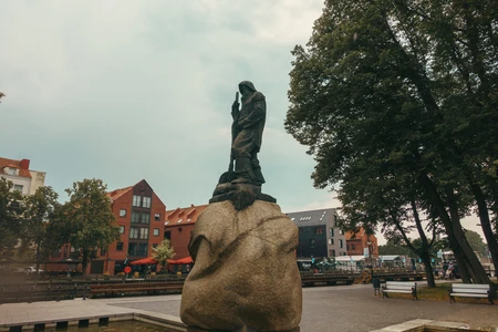 Historic Statue Amidst Urban Landscape